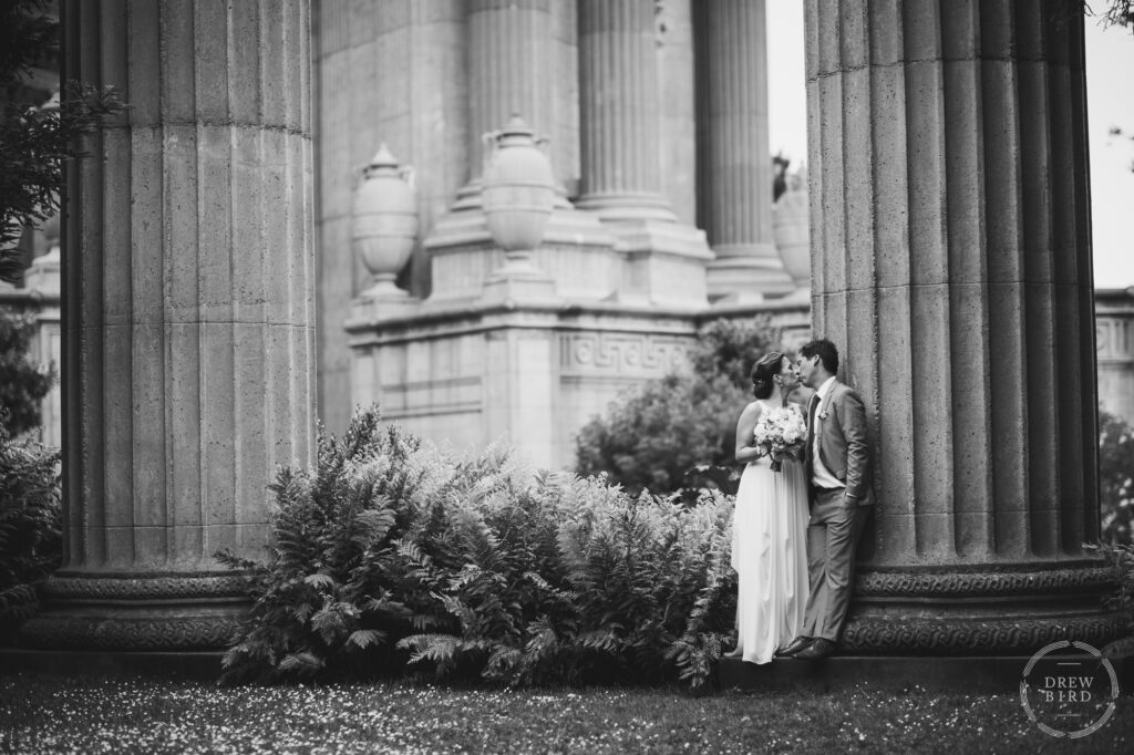 Bride and groom kissing black and white photo. Palace of Fine Arts wedding. San Francisco photographer Drew Bird.