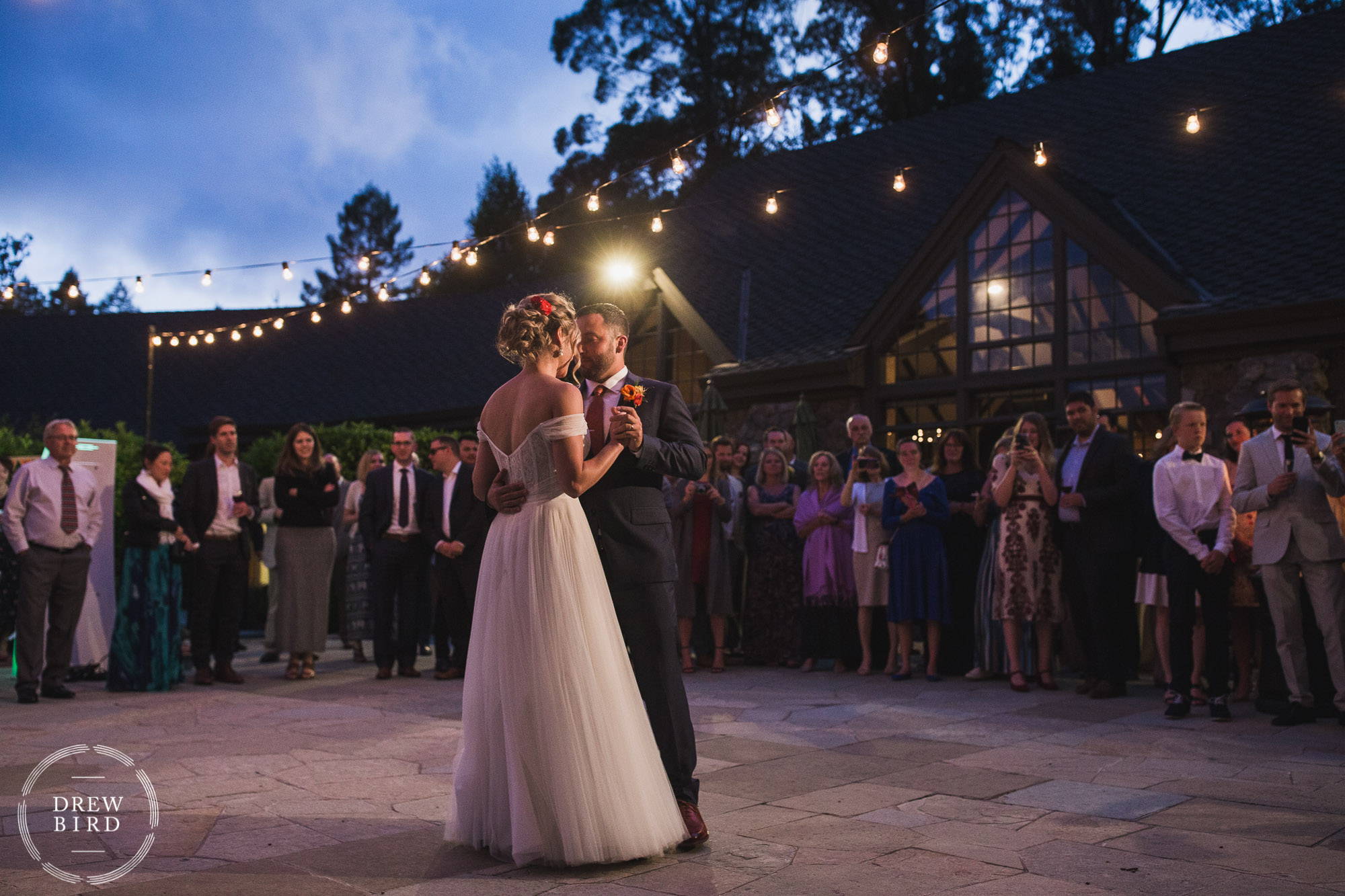 Bride and groom first dance photo on the outdoor patio at sunset for Brazilian Room wedding in Tilden Park Berkeley California.