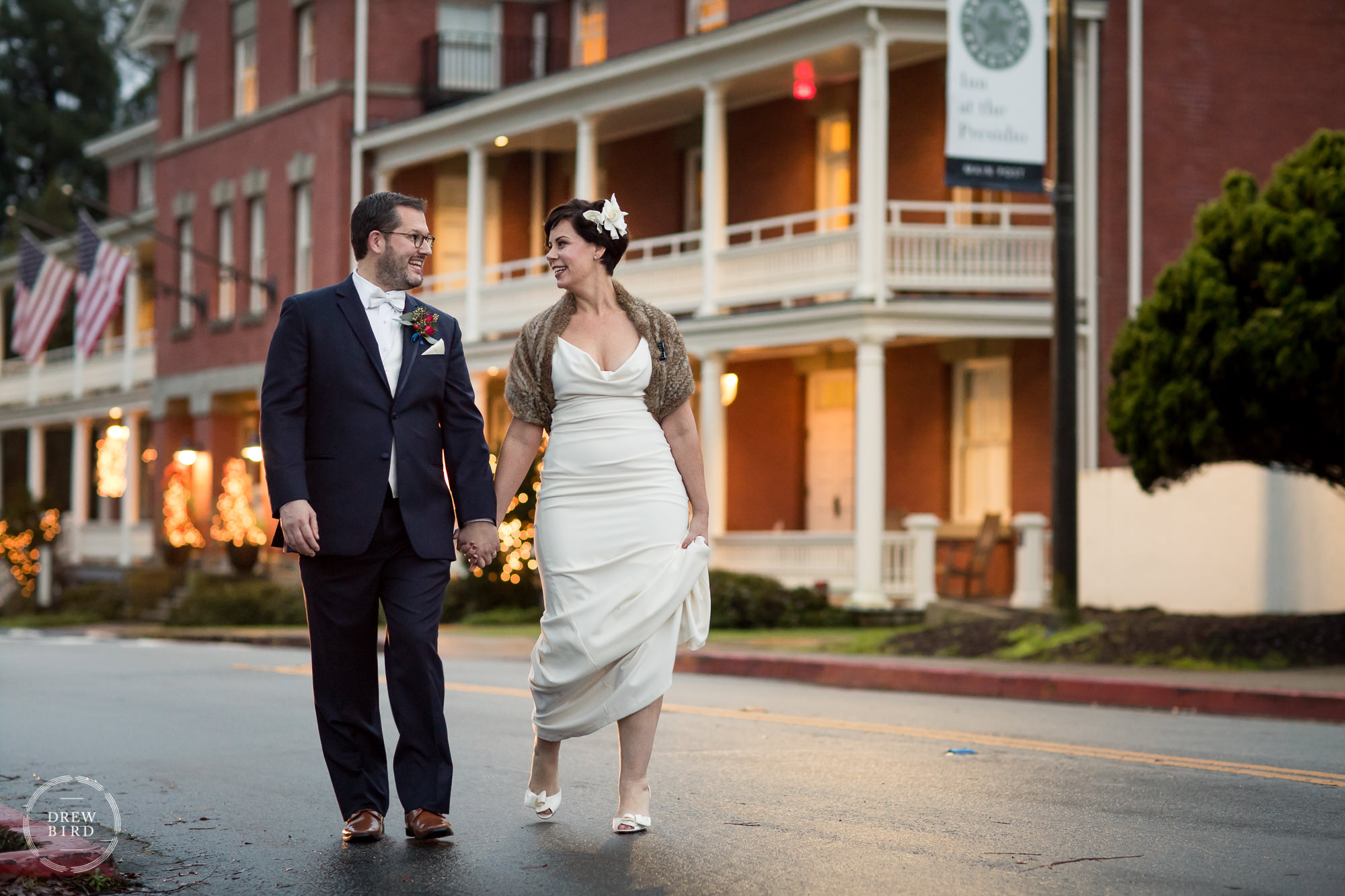 Bride and groom walking in street. The Inn at the Presidio wedding venue in San Francisco.