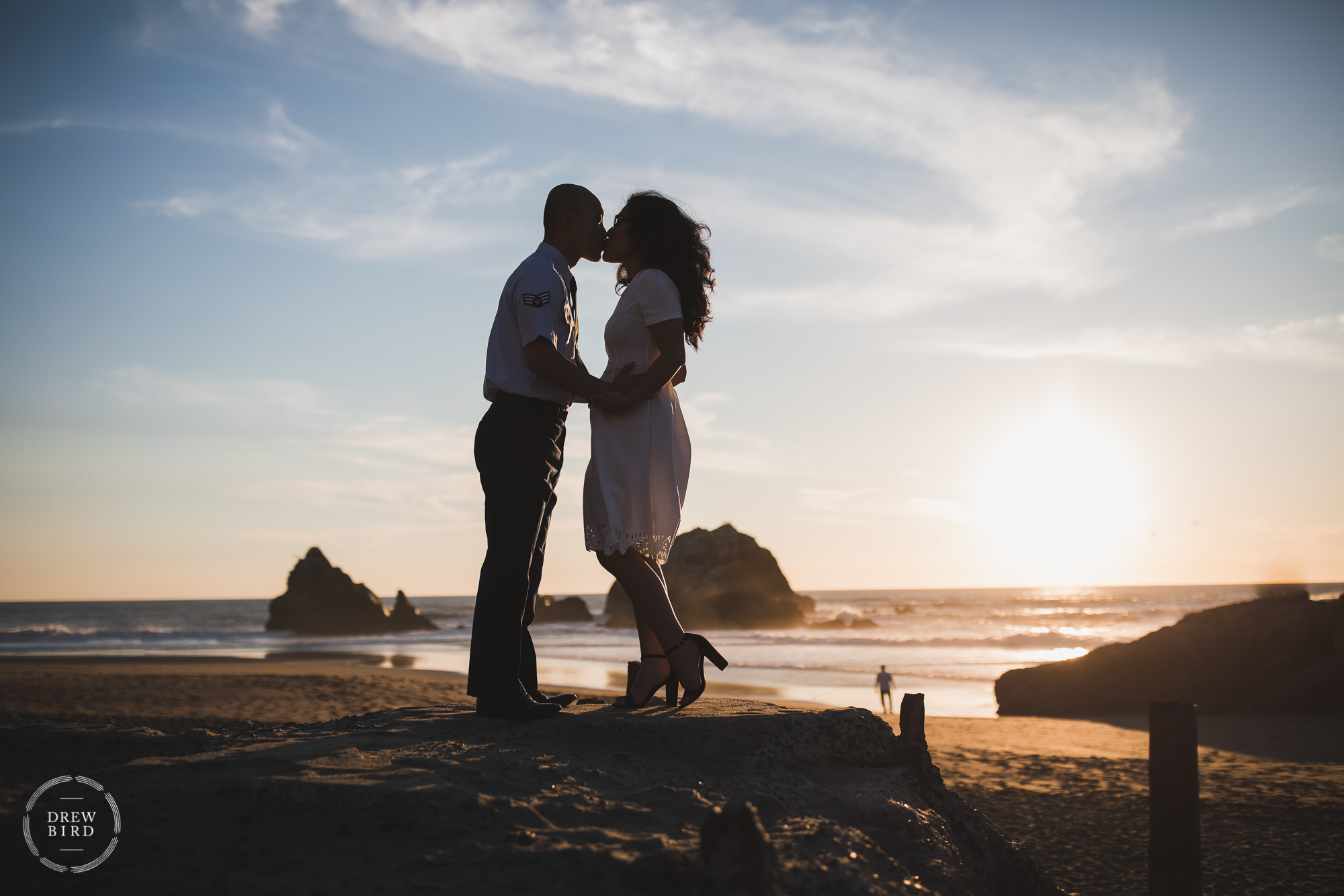 Bride and groom kissing at sunset and ocean. Sutro Baths San Francisco elopement wedding.