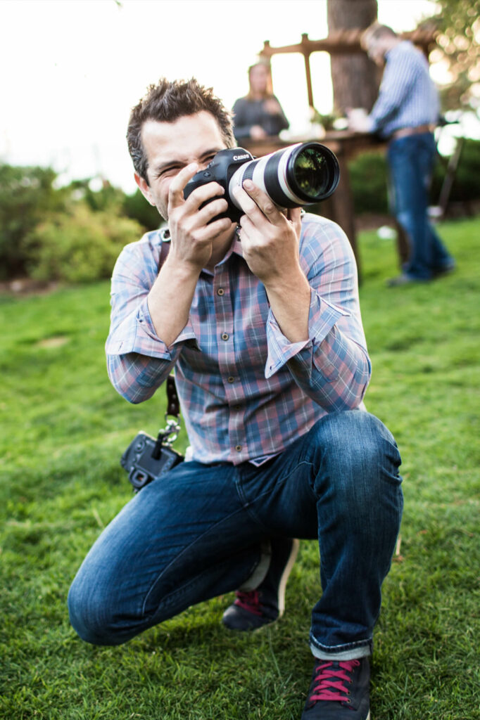 Drew Bird pictured taking a photo at a San Francisco Bay Area wedding